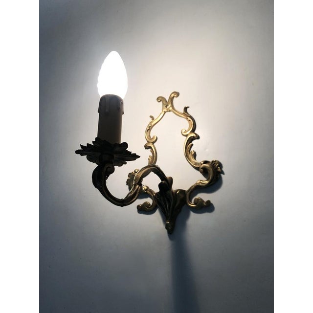 Vintage Pair of Bronze Wall Sconces, 1950s/60s Pair of bronze wall sconces, each topped with a candle and a plastic...
