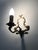 Vintage Pair of Bronze Wall Sconces, 1950s/60s Pair of bronze wall sconces, each topped with a candle and a plastic...