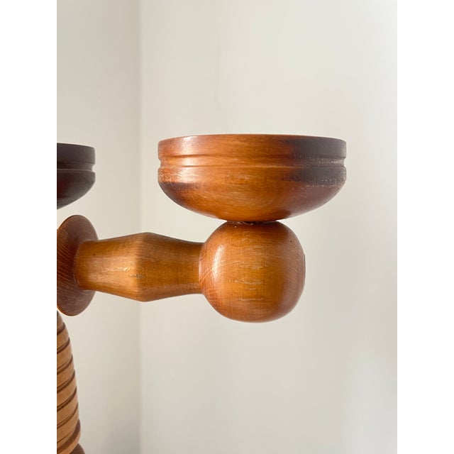 Vintage three-arm candelabra crafted entirely from finely turned solid wood, made in Sweden in 1960s. with its impressive...