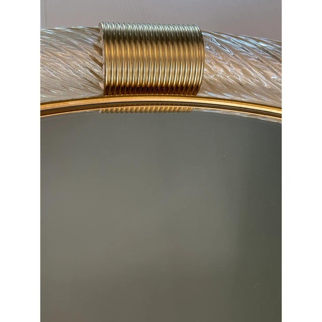 Scenographic wall mirror in Murano glass full of gold-leaf and solid Detail in brass. A luxury piece of Italian art....