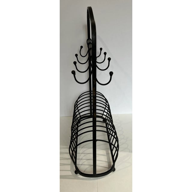 Vintage black wrought iron cup and p[alte holder. Perfect for a tight kitchen/. The plate shown is 8.5 inches in diameter.
