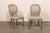 A French set of 6 Louis XVI style, oval-back upholstered side chairs from the 19th century. These antique chairs from...