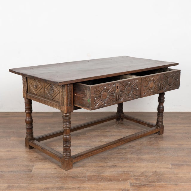 18th-century chestnut console table with deep, dark patina developed over 200 years of use. The table features carved...