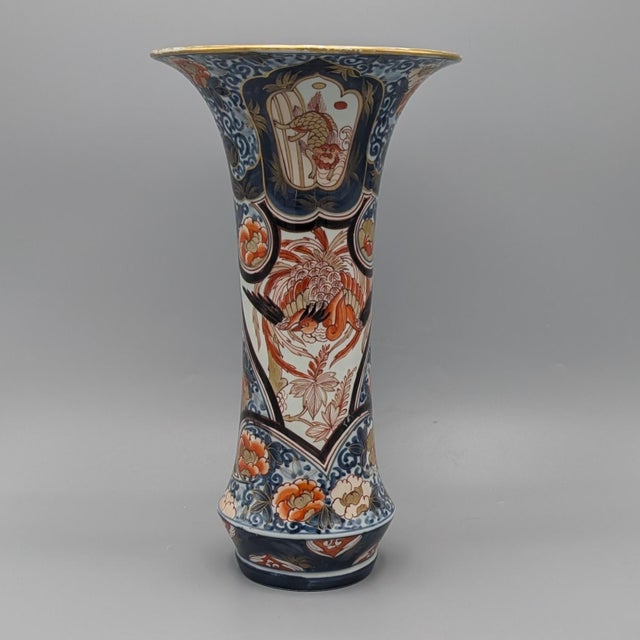 Japanese porcelain vases, c. 1720. Dimensions: Each approximately 13¼” tall. Decoration: The mouth of the vase is...