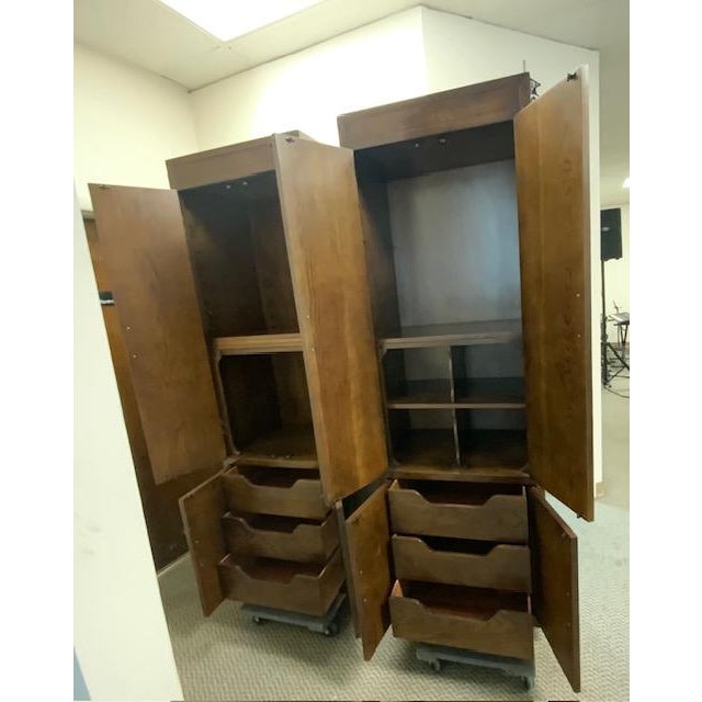 This Mid-Century Henredon pair of tall cabinets is from the iconic Scene One Collection. It's Merging architectural height...