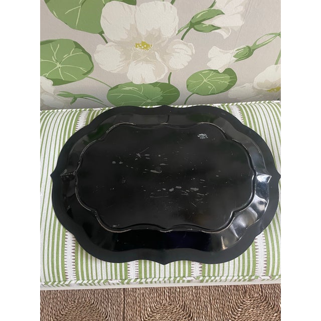 This black tole tray is a beautiful shape and highlighted with golden flowers and details. Great for drinks or for on top...