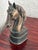 A single 1980s cast horse head bookend with a bronze tone finish. Works equally well to hold books or as a desk accent....