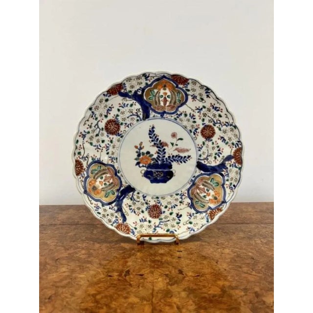 Large antique quality Japanese imari plate, having a scalloped shaped edge with quality hand painted decoration to the...