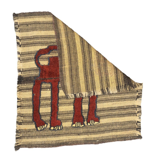 This antique Gabbeh Palas rug, woven circa 1920, is a rare piece of Persian tribal art. It features a flat-woven wool base...