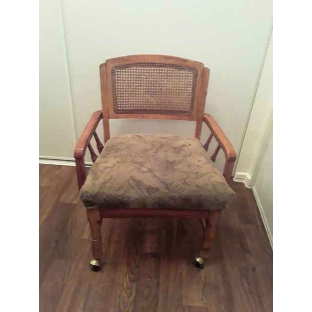 Beautiful vintage cane back chair on wheels — a versatile piece with real character for a home office, vanity, or reading...