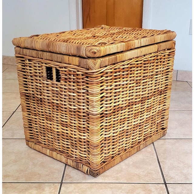 Unique square rattan chest with hinged lid and openings on sides for handles. This is a very sturdy and versatile vintage...