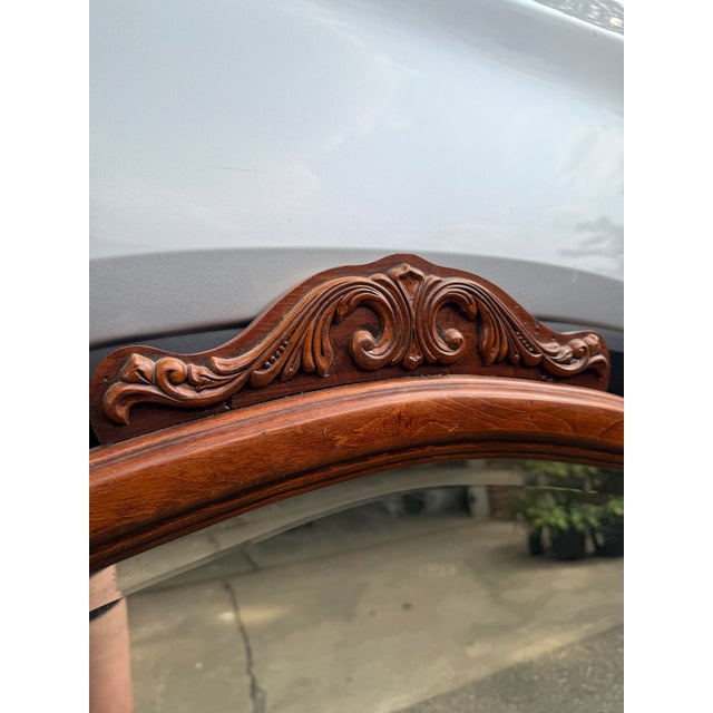 Vintage mirror that likely accompanied a dresser. Scroll designs Needs a little bit of cleaning and has normal signs of...