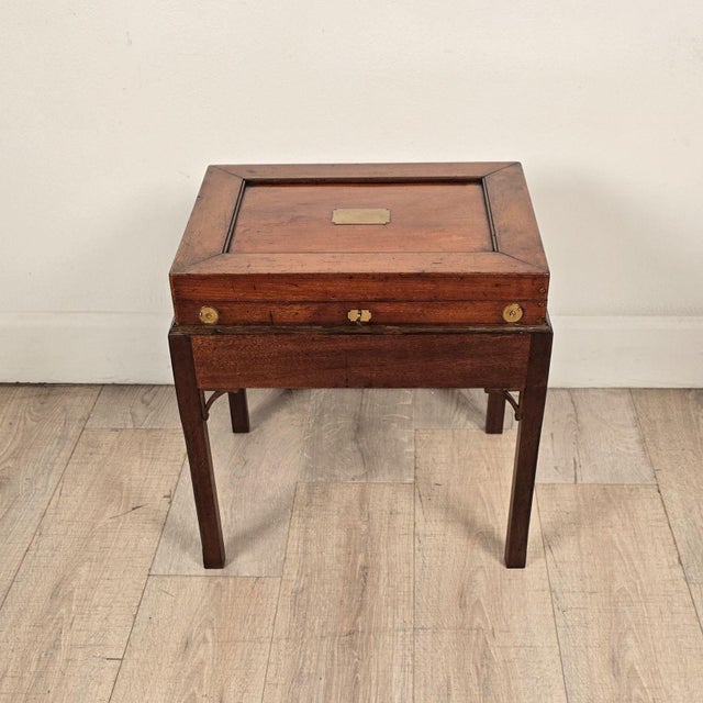 A 19th-century English Victorian mahogany brass-mounted box on later custom stand.