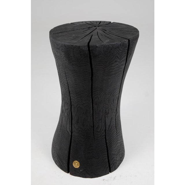 Chainsaw carved side table/pedestal. Carved from a single piece of burnt oak wood and protected with the highest quality...