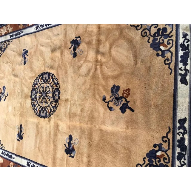 Nice half hand and half machine knotted European rug with a Chinese Pekin design and a yellow field color, with blue and...