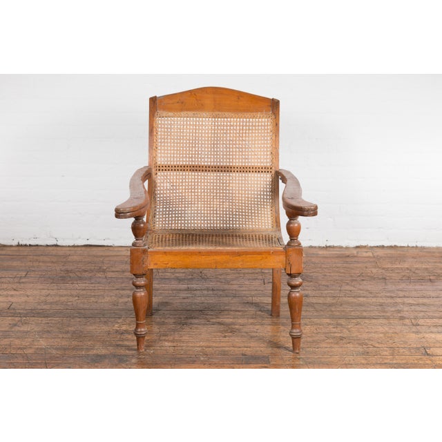 Traditional Dutch Colonial Indonesian Cane and Wood Plantation Chair with Extending Arms For Sale - Image 3 of 12