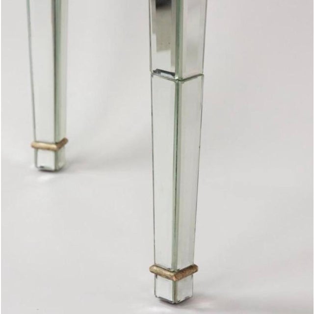 Mirrored Hollywood Regency or Art Deco style Demi-Lune Console Table. Unusual table has a wooden frame covered in small...