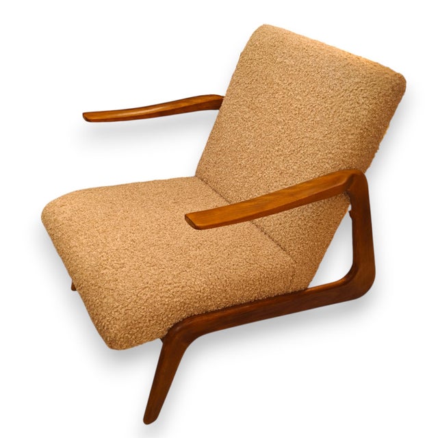 Pair of Italian armchairs from the 1970s in teak wood. Upholstered in a beige Bouclé fabric.