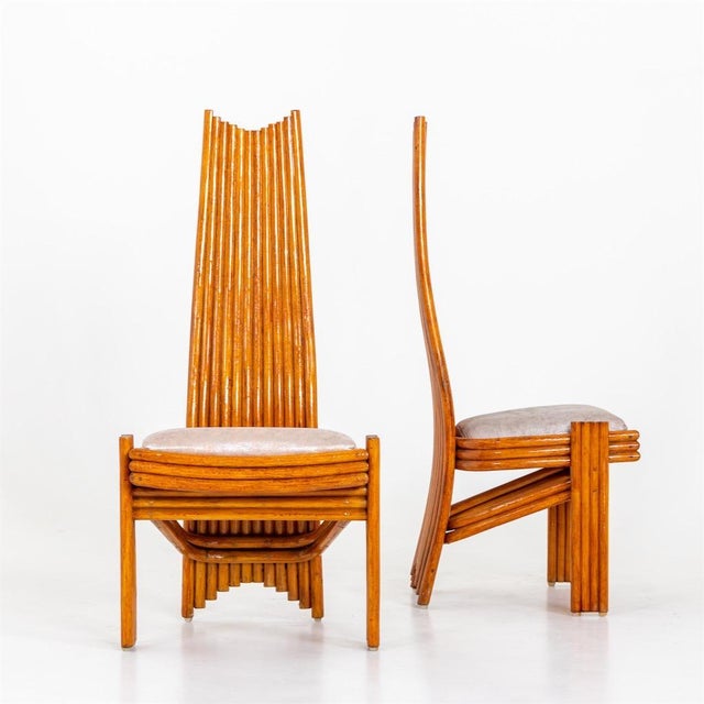 A set of six tall back Modernist dining chairs. Stained bamboo with upholstered seats.