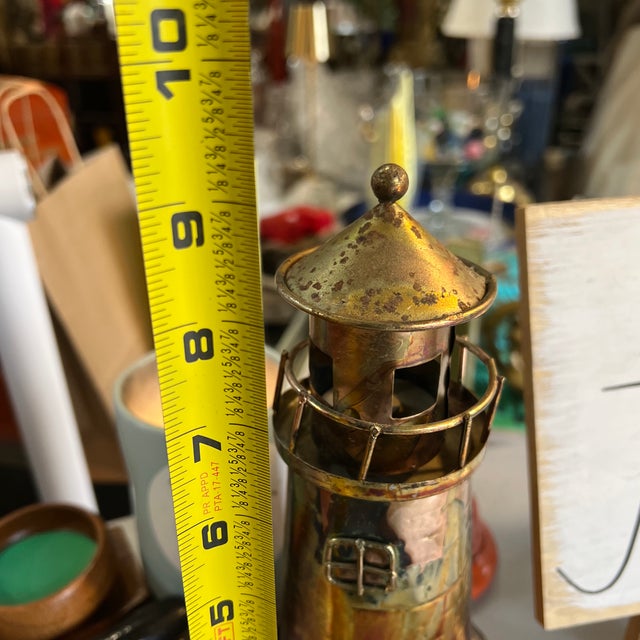 Up for consideration is a beautiful vintage metal lighthouse sculpture. This would look lovely in your home, and it is the...