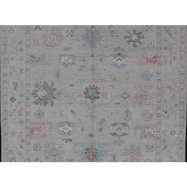 All Over Modern Floral Oushak with A Light Blue-Gray Field and Border Keivan Woven Arts; rug AWR-8546 Country of Origin:...