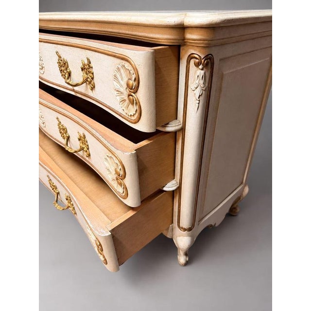 Bring timeless French elegance into your home with this grand early 20th-century commode, featuring an undulating...