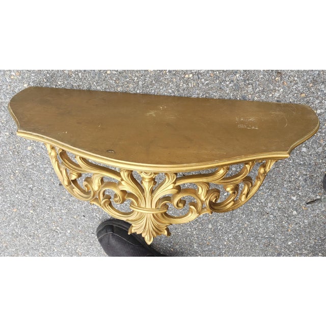A large 23.25" Syroco Ornamental Italian Style Giltwood Wall Shelf. Good vintage condition. Measures 23.25" in width, 10"...