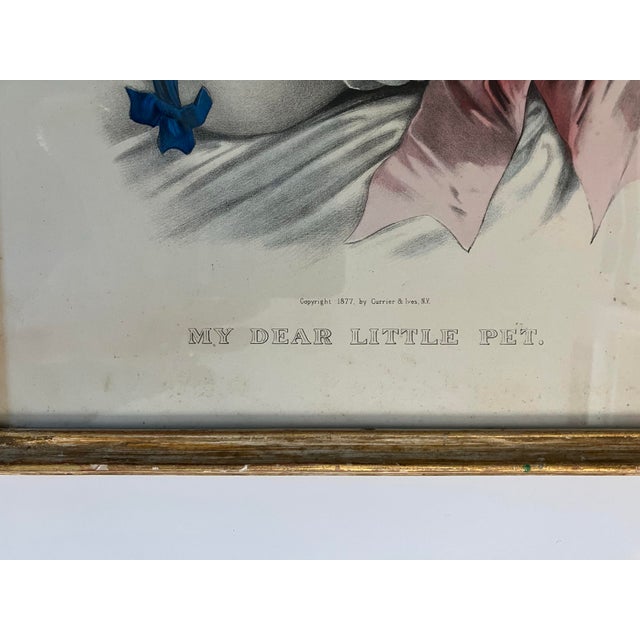 This antique print “ My Dear Little Pet” was printed in 1877 by Currier & Ives The frame is by Newcolm-Macklin , Chicago