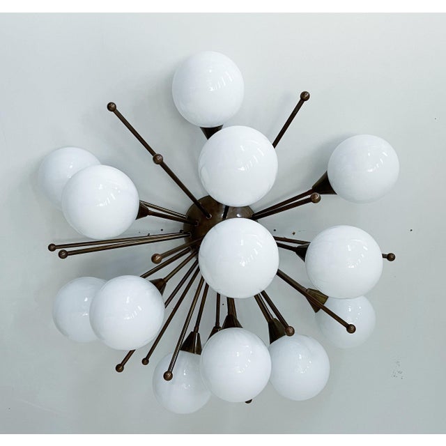 Italian sputnik flush mount with glossy white Murano glass globes mounted on solid brass frame in bronze finish / Made in...