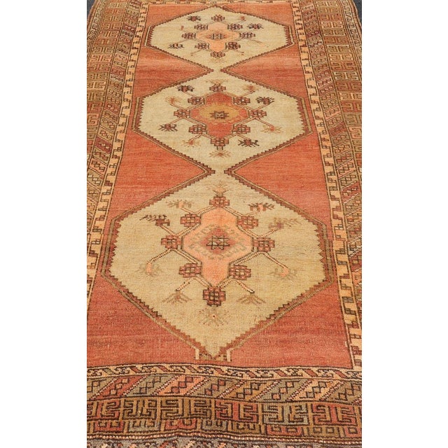 Measures: 5'5 x 11'2 Vintage Turkish Gallery Kars Rug with Soft Cream and Terracotta, 5'5" x 11'2". Keivan Woven Arts /...