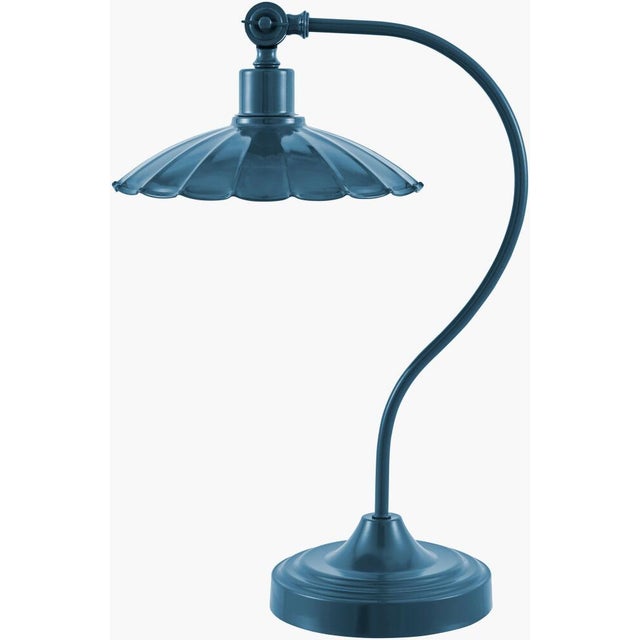 Illuminate your space with the striking allure of the Pavona accent table lamp, where industrial meets rustic in a...