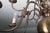 Twelve-arm two-story chandelier made of patinated brass. The chandelier is fully functional with new wiring. Electric...