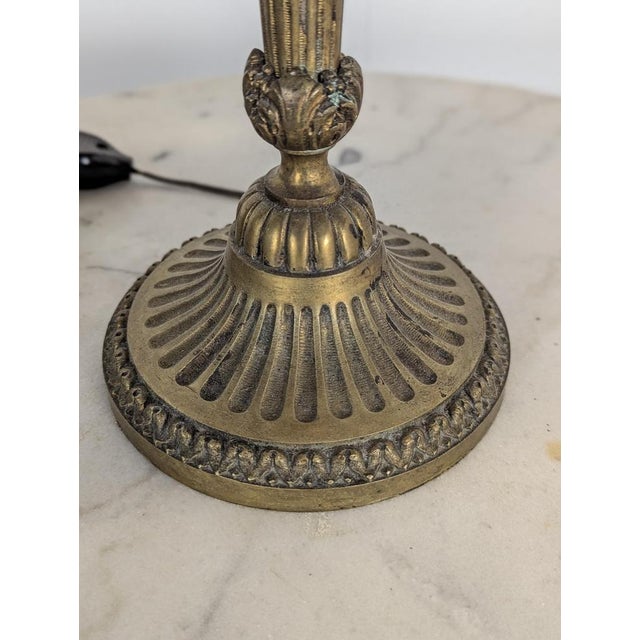 Neoclassical Brass Table Lamp, in Very Good conditions. Up to 250V (Europe/UK Standard).The wiring of this item may be...