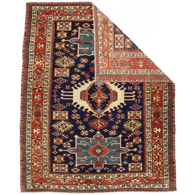The numerous rugs of the famous NW Persian weaving district, from small scatters to giant carpets and a few runners, in...