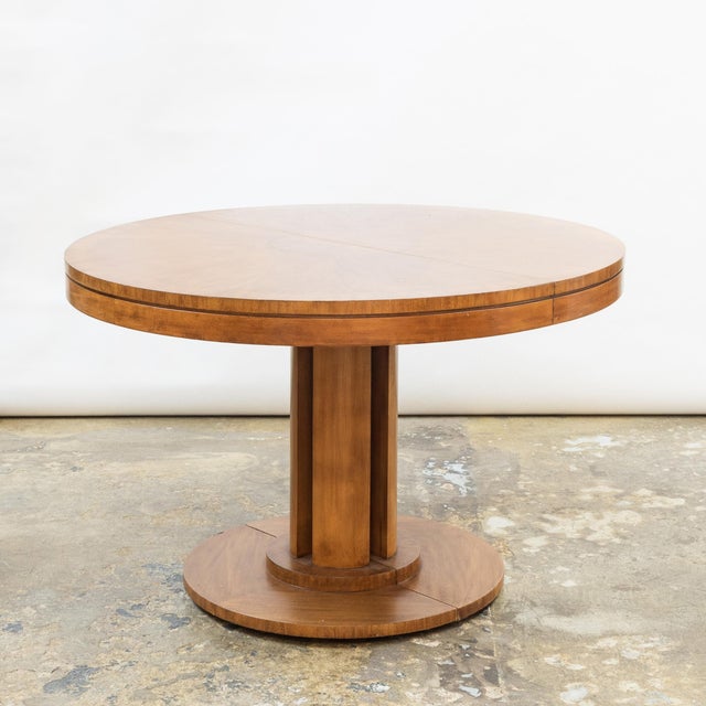 Post-modern neo-classic pedestal table by Michael Taylor for Baker (unmarked), with circular veneer burl medallion and...
