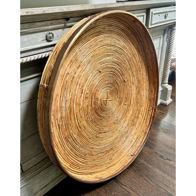 A fabulous oversized vintage round tray handcrafted from tightly coiled pencil reed rattan, finished with a substantial...