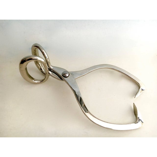 Silver plate ice tongs hay hooks, when you move your ice or pick up the hay. Be the chicest with your block! This pair of...