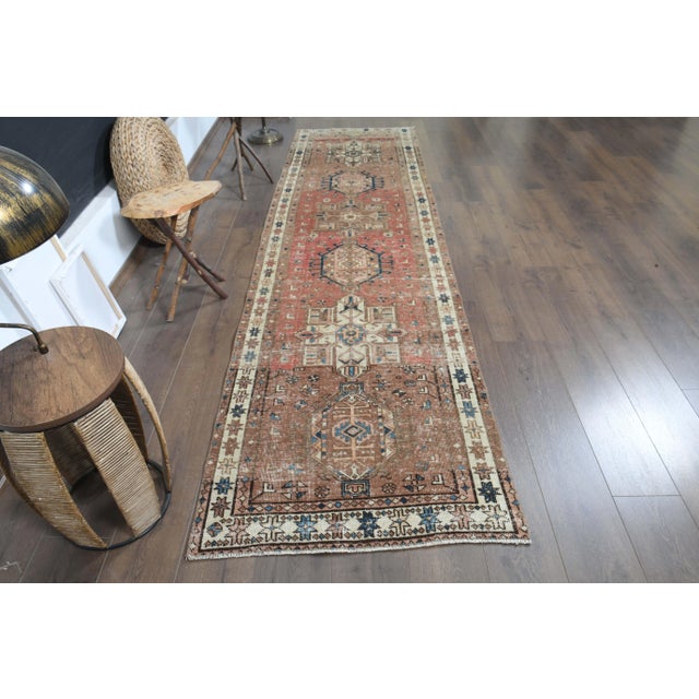 Vintage Turkish Hand-Knotted vintage rug is a semi- vintage runner rug.'70s Eastern region of Turkey's unique rug is...