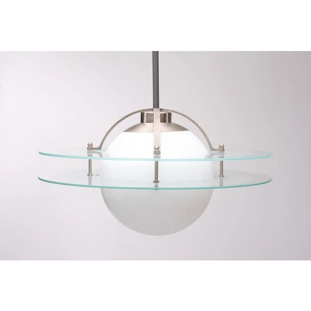 The 'Saturn lamp' was in production from 1931 to 1957, during this period some details of the lamp were changed. From the...