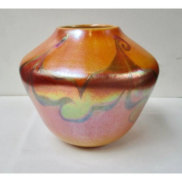 LCT Louis Comfort Tiffany Favrile glass vase. Marked LCT and F 1790. The size is 5.75" tall and 6.5" in diameter. The...