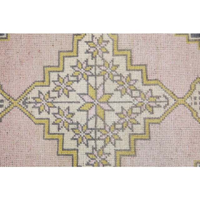 Introducing our exquisite vintage mini Turkish rug, expertly crafted by skilled artisans using traditional techniques that...