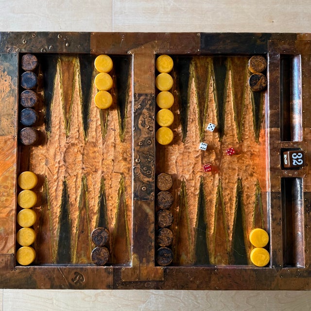 This backgammon table by designer Paul Evans, is made from patch worked copper with an enamel coating. The felt backed...