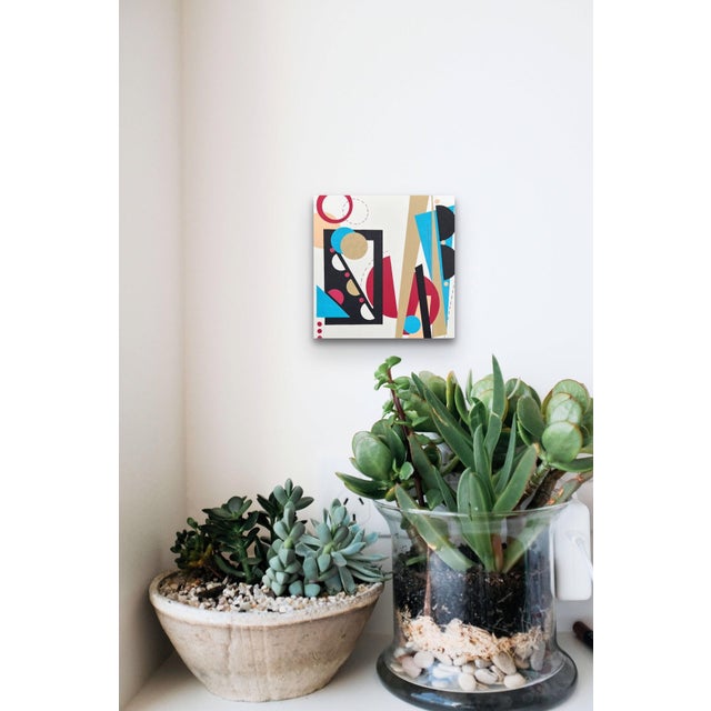 Somersault features a dynamic interplay of geometric shapes and vibrant colors, creating a sense of movement and energy....