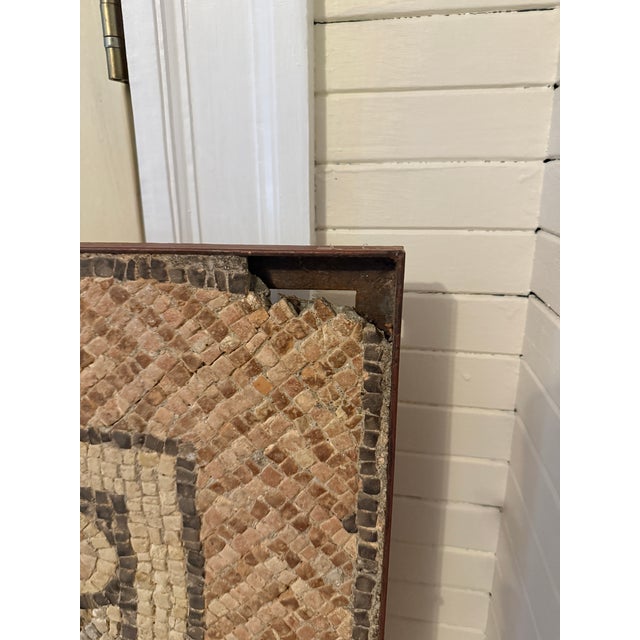 A substantial and architecturally evocative Roman mosaic pavement fragment, dating to the 4th - 5th century CE (or AD)...