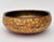A decorative hand-painted Kashmiri paper mache bowl with brass lining. Its surface is covered with golden maple leaves and...