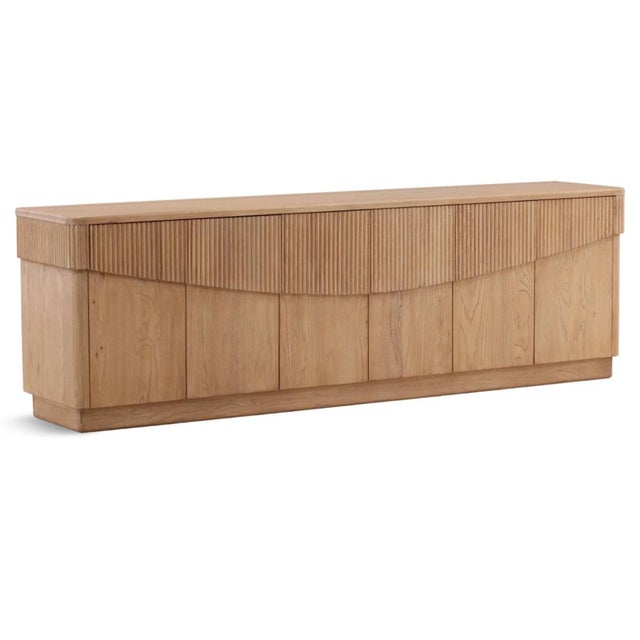 Crafted from beautifully grained oak in a light natural finish, this striking sideboard combines clean contemporary lines...