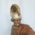 This monumental vintage sculpture depicts a 16th-century-style Spanish conquistador dressed in ornate armor, a plumed...