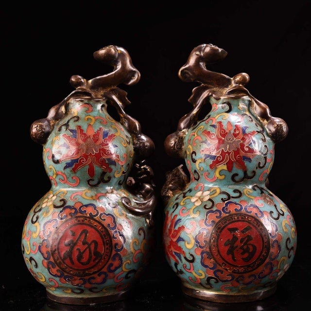 This striking vintage cloisonne enamel vase is finely modeled in the form of a double gourd, a traditional symbol of...