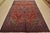 An authentic vintage traditional Heriz rug hand-knotted with fine wool and natural dyes. This rug features a central...