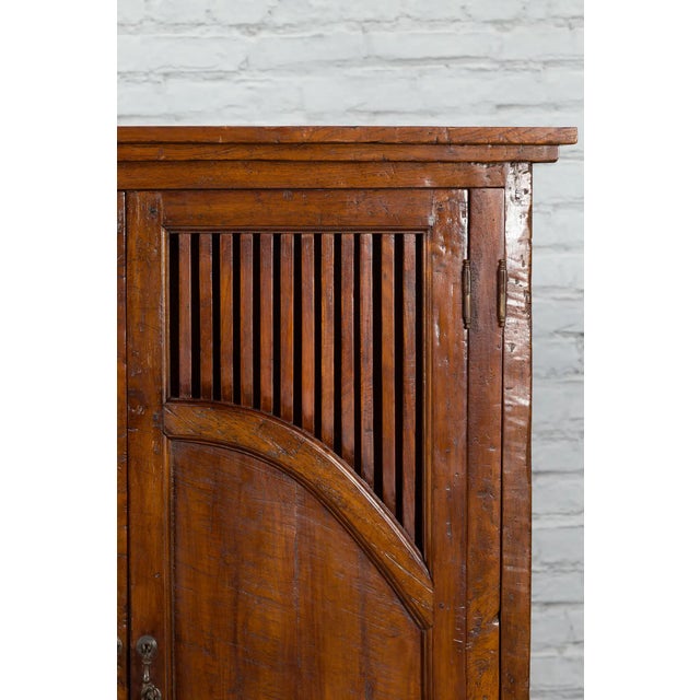 Javanese Antique Teak Armoire with Slatted Motifs, Tapered Feet and